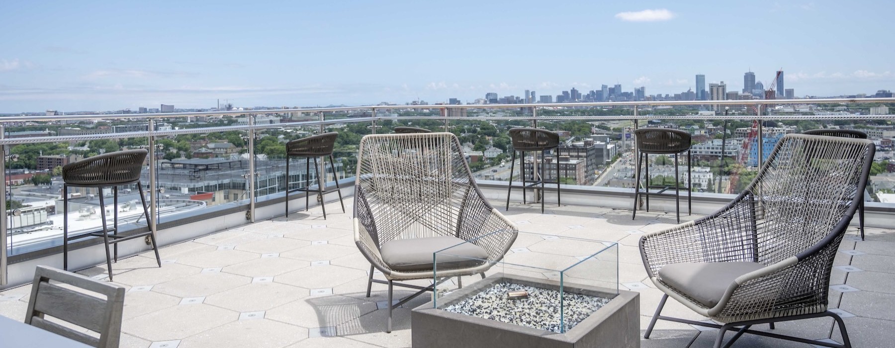 a rooftop lounge with chairs