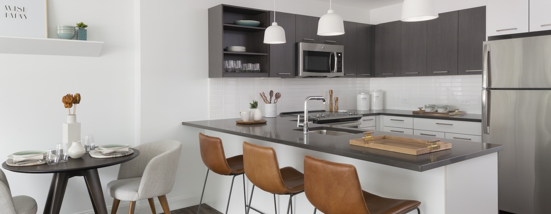 a kitchen with a table and chairs